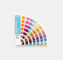 Load image into Gallery viewer, A Pantone Color Bridge Uncoated colour guide GG6104C fan deck displayed on a light grey background. The fanned pages show a wide array of colour chips in various hues, with the vertical cover on the left displaying 'COLOR BRIDGE Unbound' and 'PANTONE'.