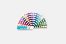 Load image into Gallery viewer, Pantone Color Bridge coated GG6103C color guide fan deck displayed on a light gray background. The semi-circular fan contains multiple rows of colour chips in a rainbow spectrum, with a turquoise and white brand label at the bottom.